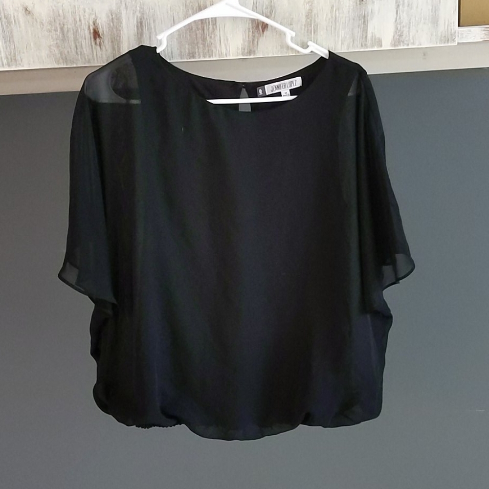 Black butterfly shirt (because of the sleeves 😊)